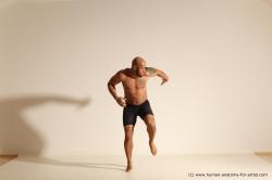 Underwear Gymnastic poses Man Black Muscular Bald Dancing Dynamic poses Academic